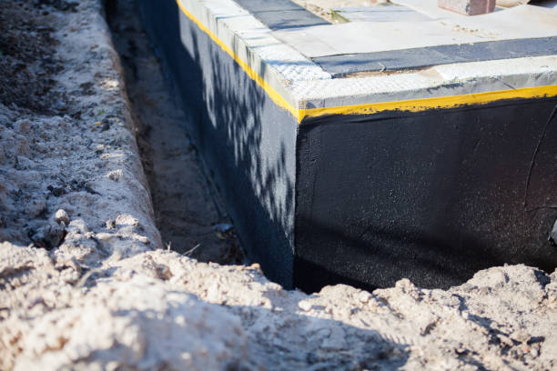 Professional Basement Waterproofing technician working in Macedon, NY